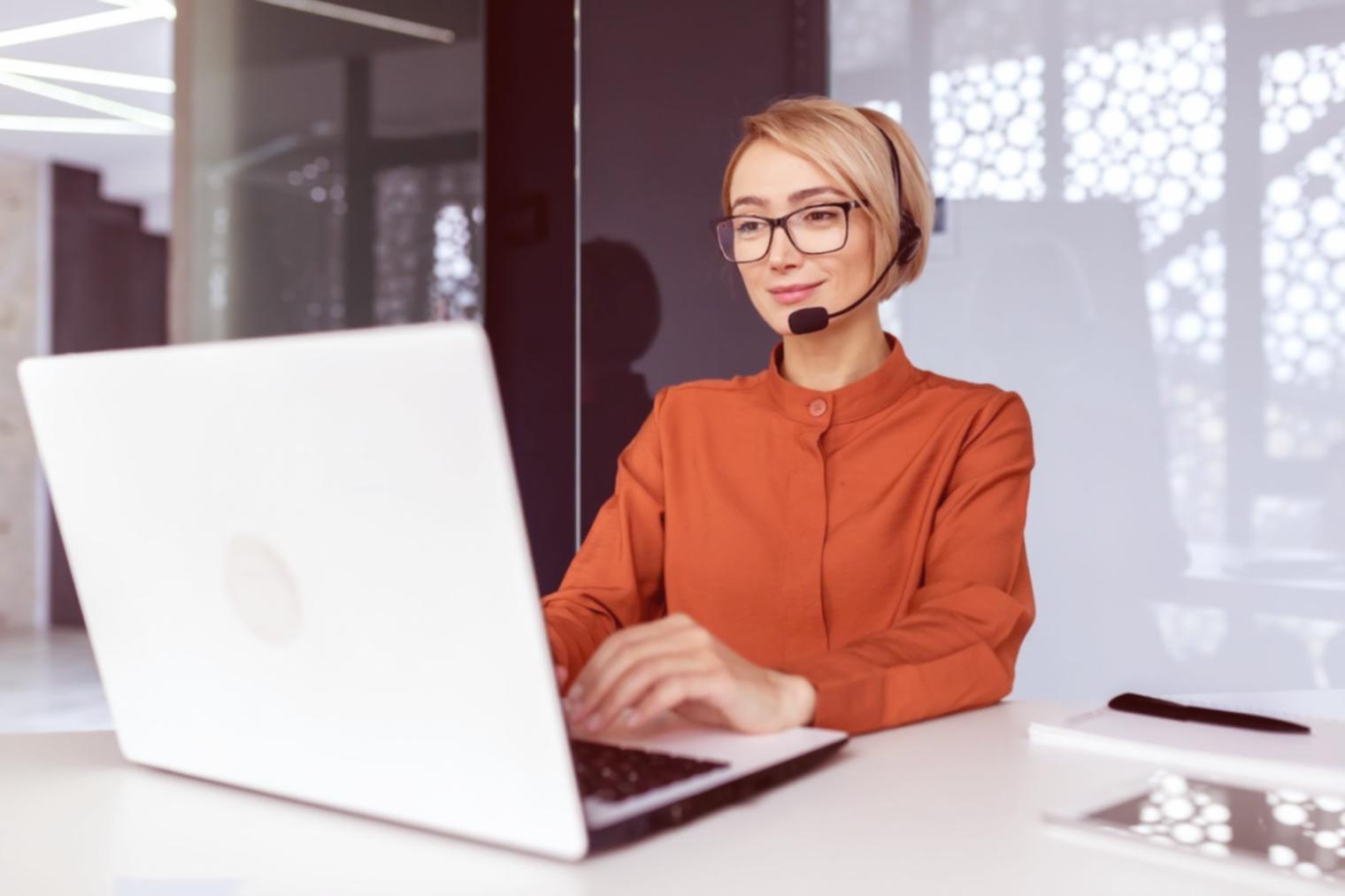 Team reviewing SEO analytics reports with trend graphs and performance metrics displayed on laptop screen